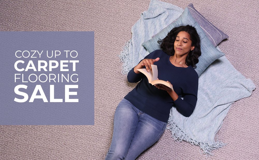Woman Laying on Carpet Reading a Book